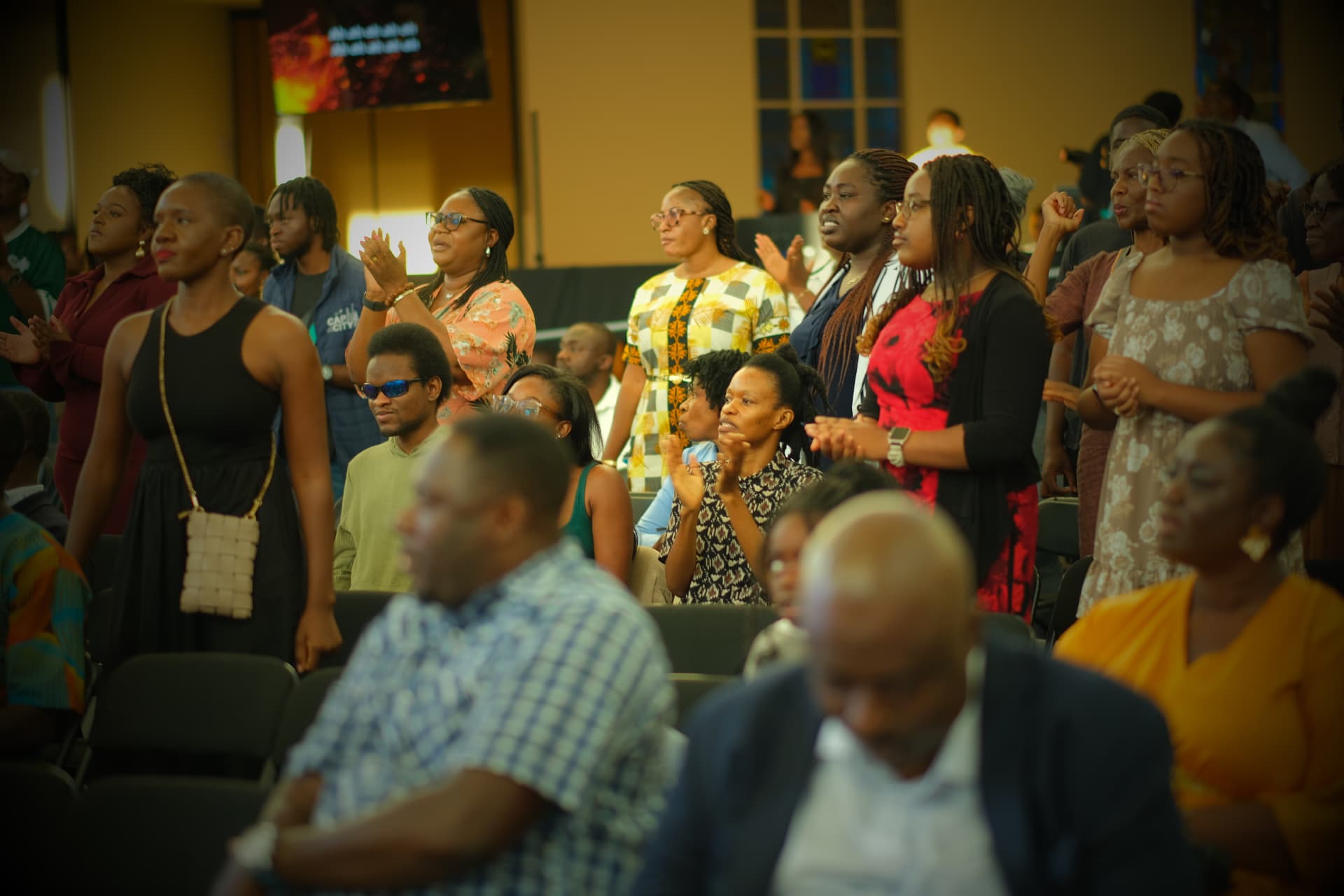 PIWC Bay Area congregation standing in worship