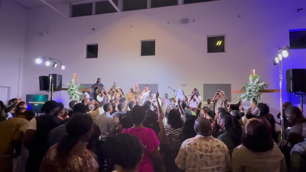 PIWC Bay Area congregation worshipping with hands raised